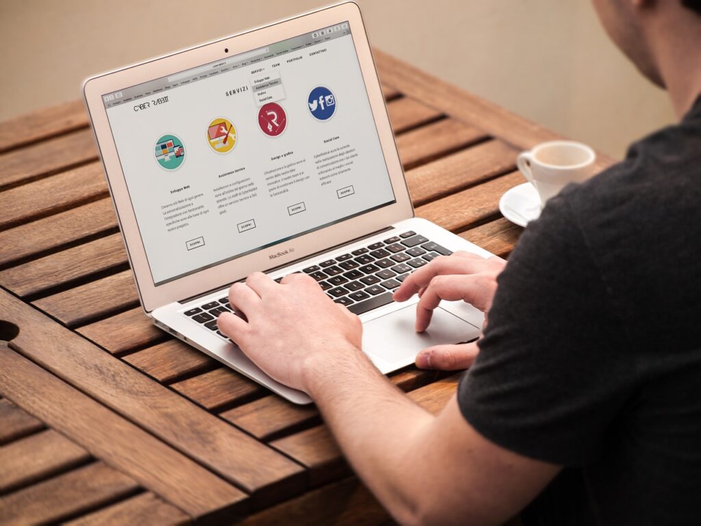 A man visiting a website on a laptop 